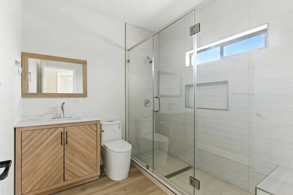 Modern bathroom with double vanity and tile finishes